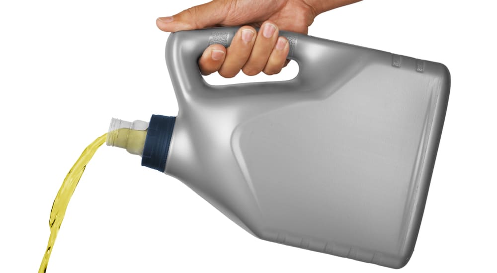 Synthetic oil pouring from bottle
