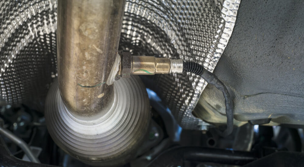 The Oxygen Sensor is on a car exhaust pipe.