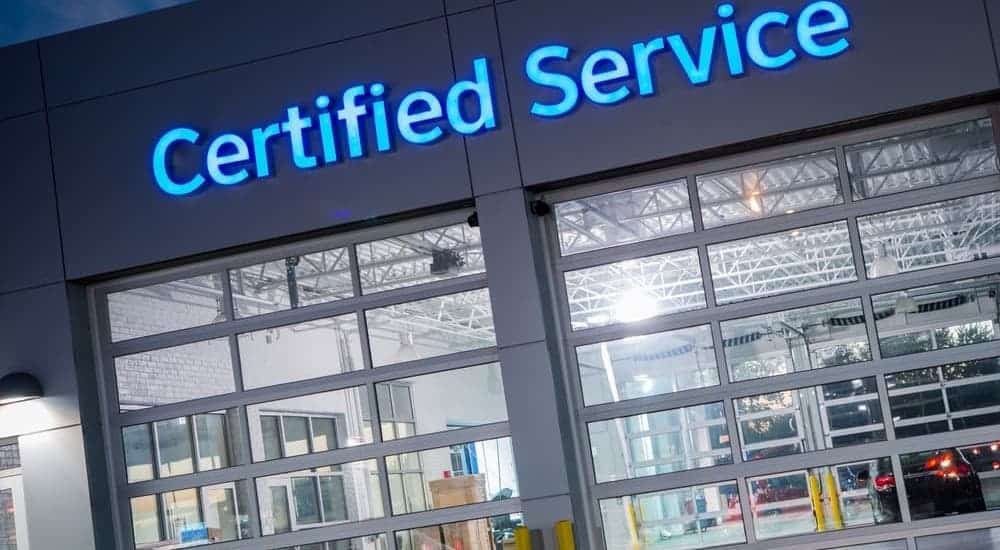 A dealership garage that says 'Certified Service' on it in blue.