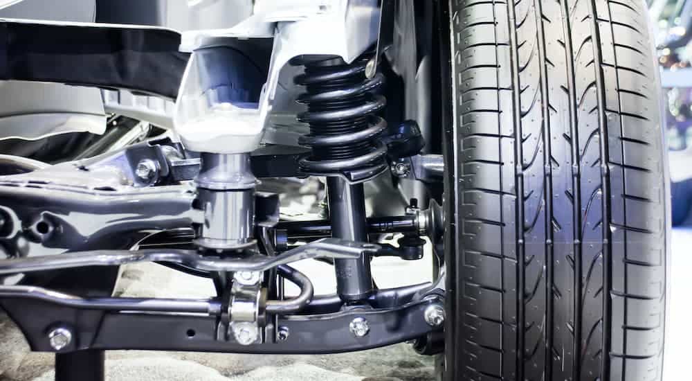 A close up is shown of the suspension on a vehicle.