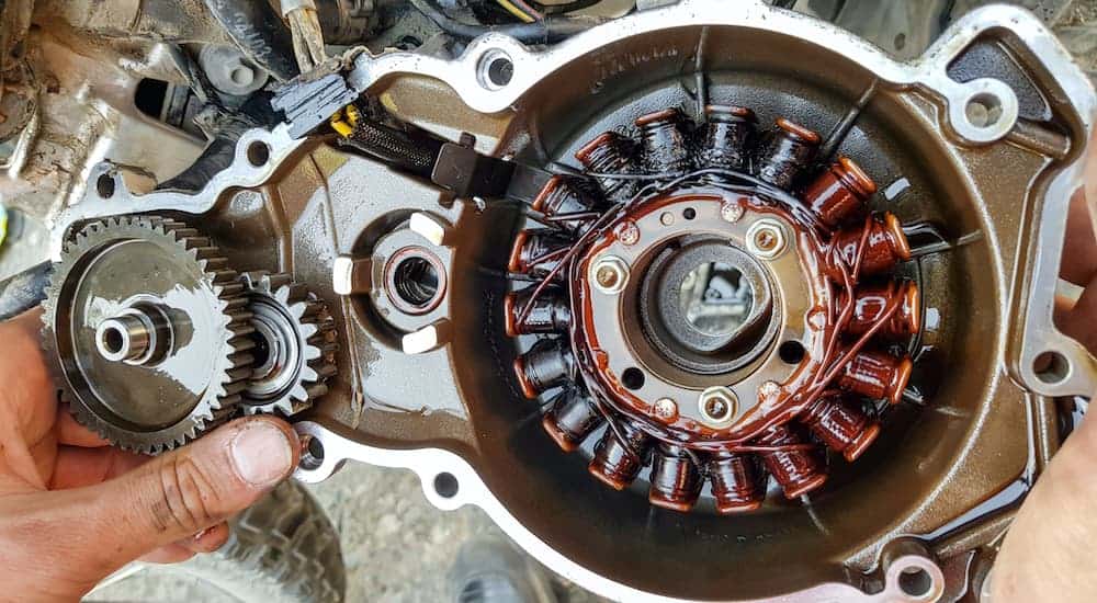 An alternator housing assembly is open exposing the interior coils.