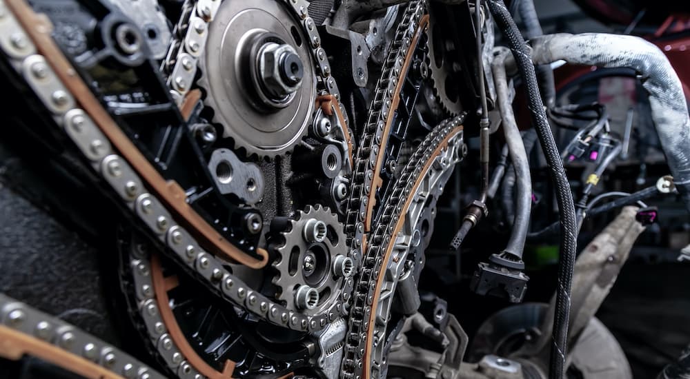 A close up shows timing chain components.