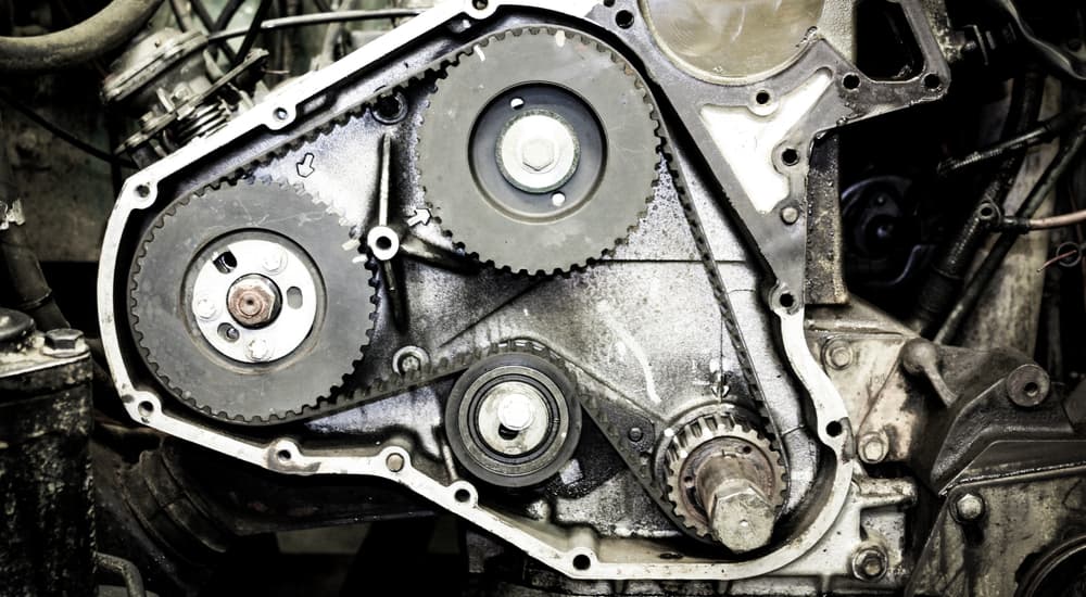 An engine cut out shows a timing belt.