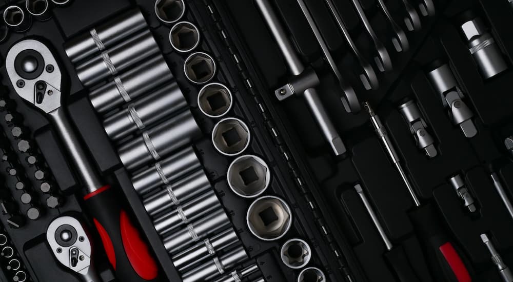 A close up shows a socket wrench set.