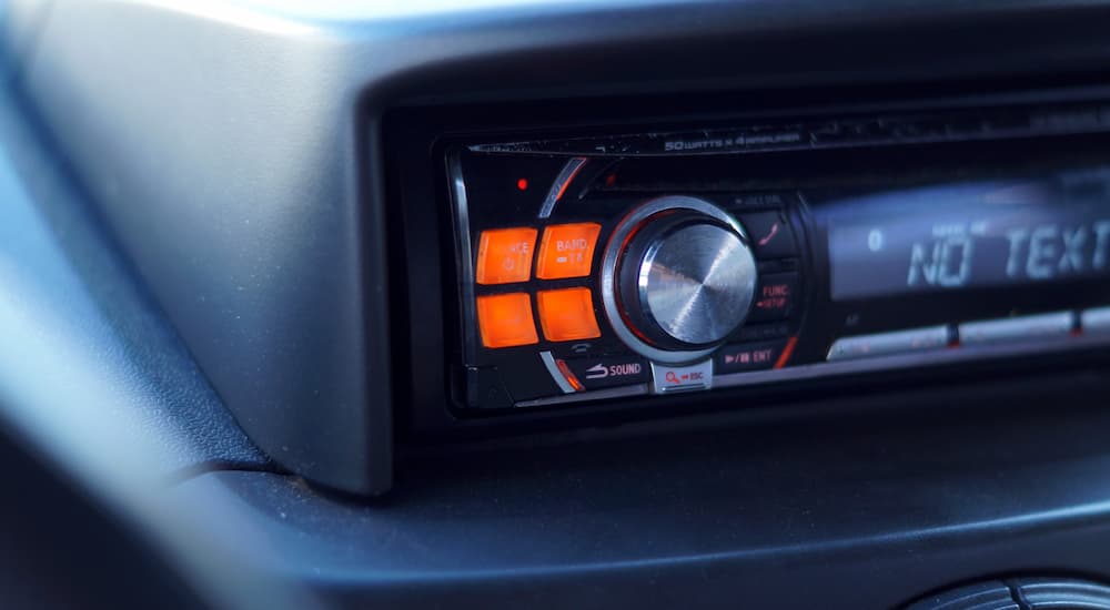 A close up of an aftermarket car radio is shown.