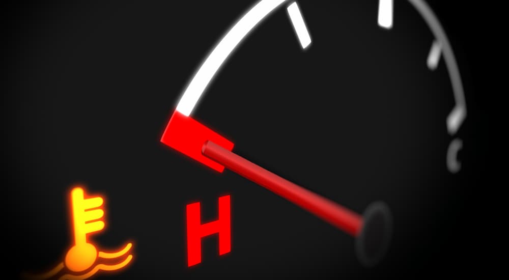 A close up of a temperature light during Honda car maintenance is shown. 