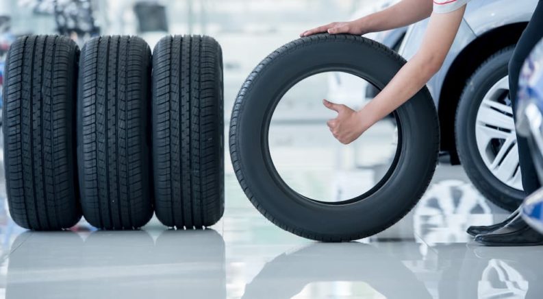 A person is shown giving a thumbs up next to a set of Honda tires.