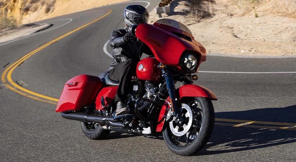 A red 2022 Harley Davidson Street Glide Special is shown from the front.
