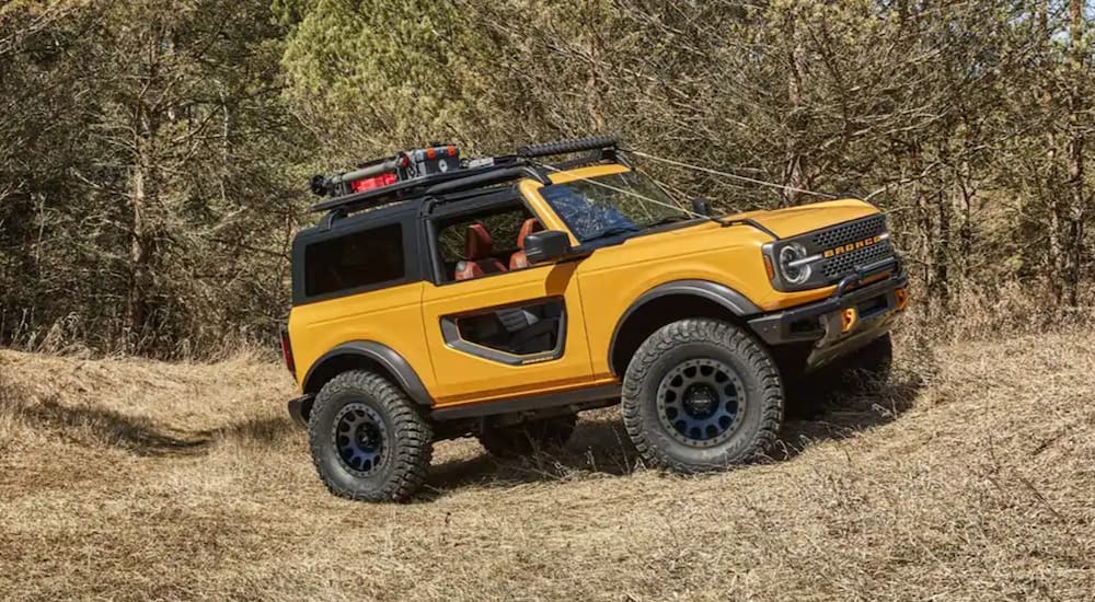 A 2021 Ford Bronco is shown off-roading.