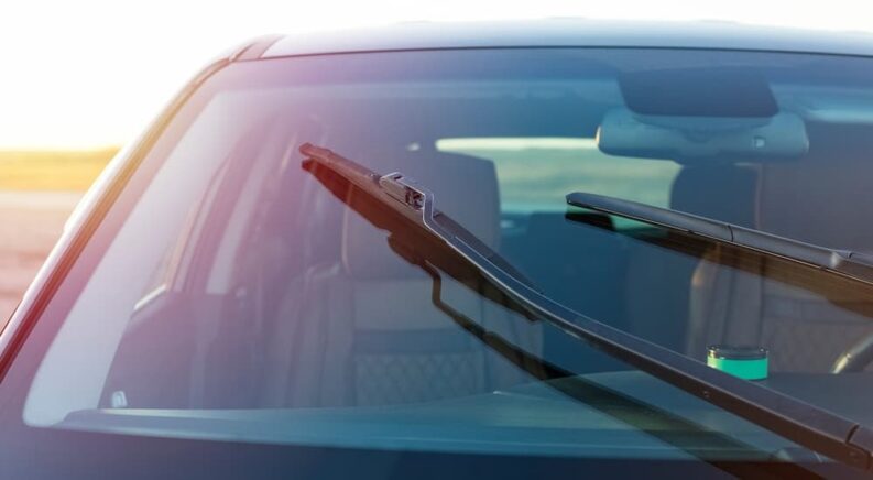 A windshield with two wipers is shown.