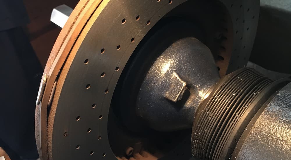 A rotor on a Brake lathe machine is shown.