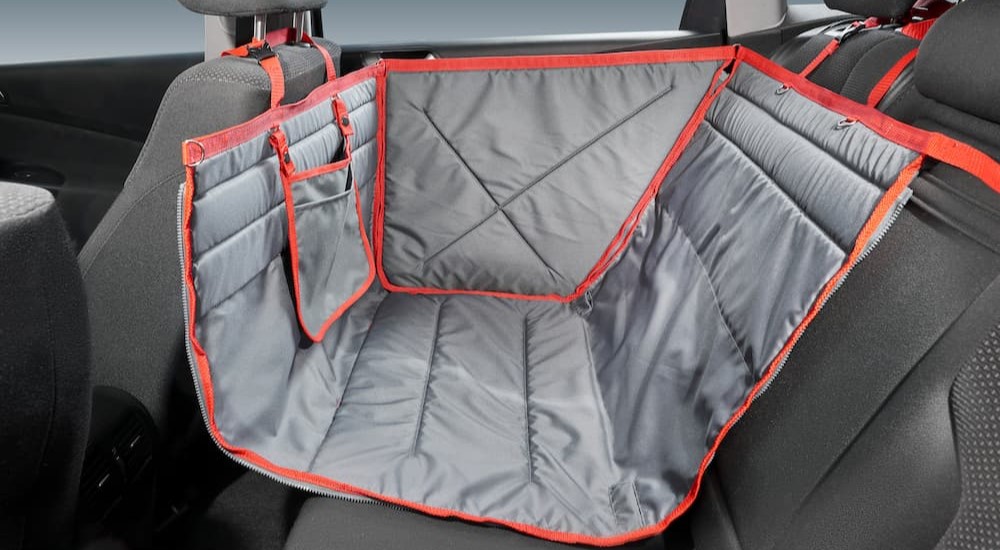 A backseat cover for pet protection is shown.