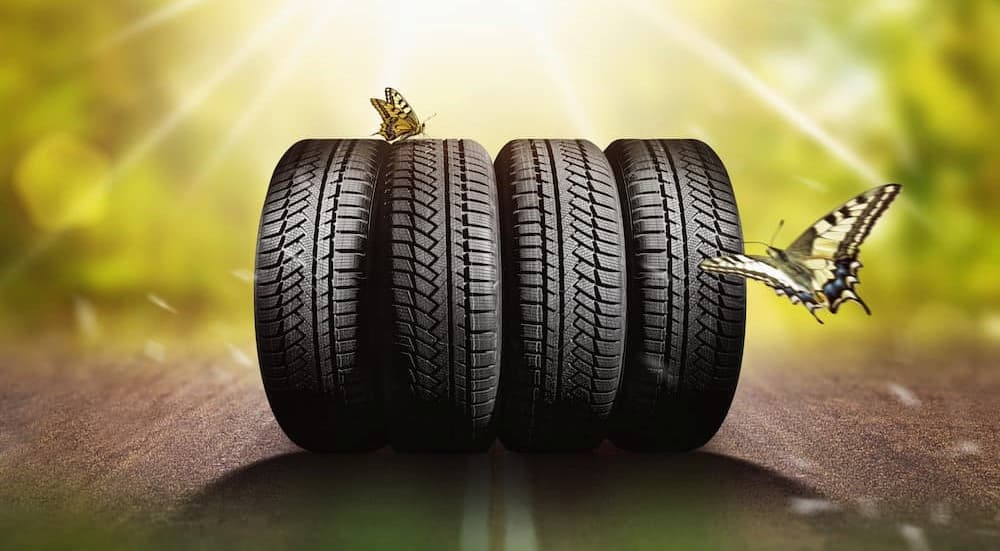 Four tires are shown near butterflies.