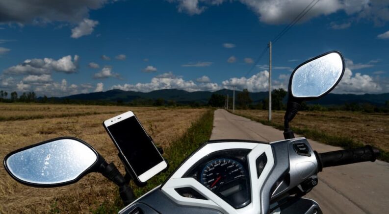 A phone mount is shown on a motorcycle.