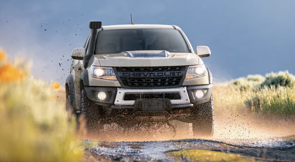 A tan 2022 Chevy Colorado ZR2 Bison is shown off-roading.