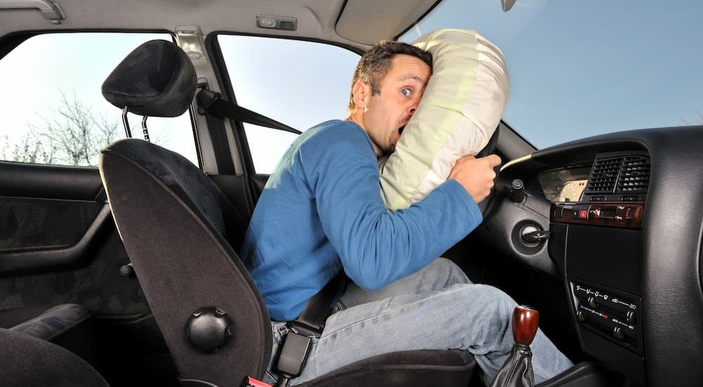 A person is shown being saved by an airbag.