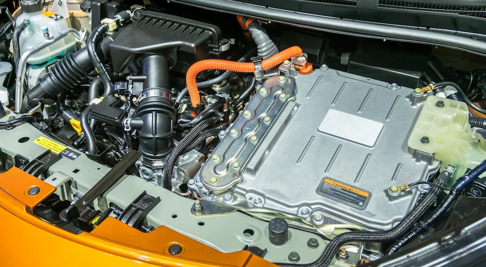 The battery and internal combustion engine under the hood of a PHEV. 