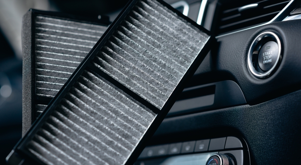 A close-up view of dirty cabin air filters.