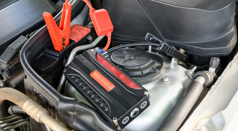 A high-powered battery power bank is shown in an engine bay.