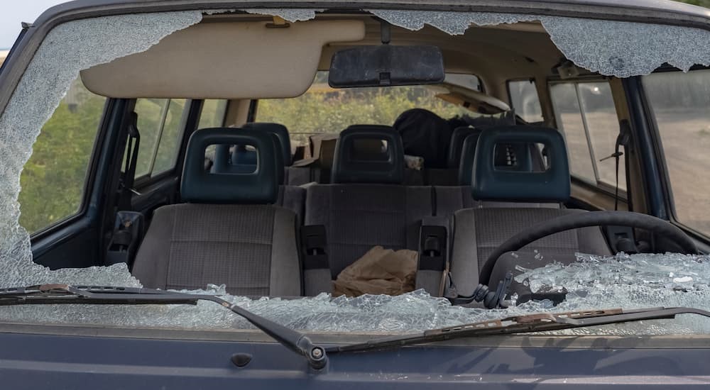 The windshield don a vehicle is shown shattered.