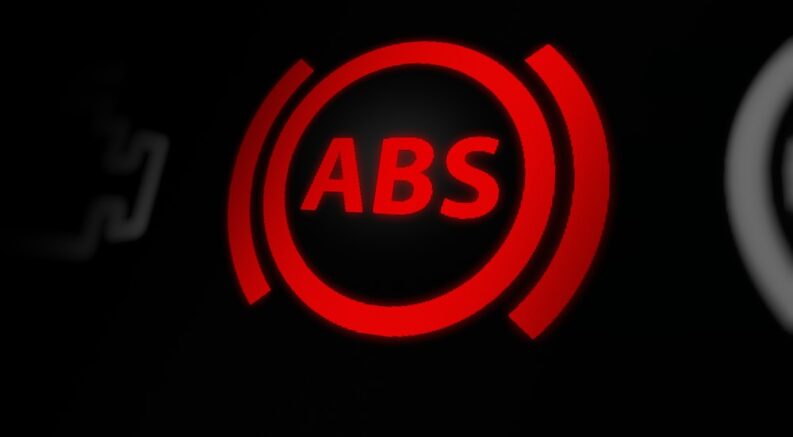 A red ABS warning light is shown.