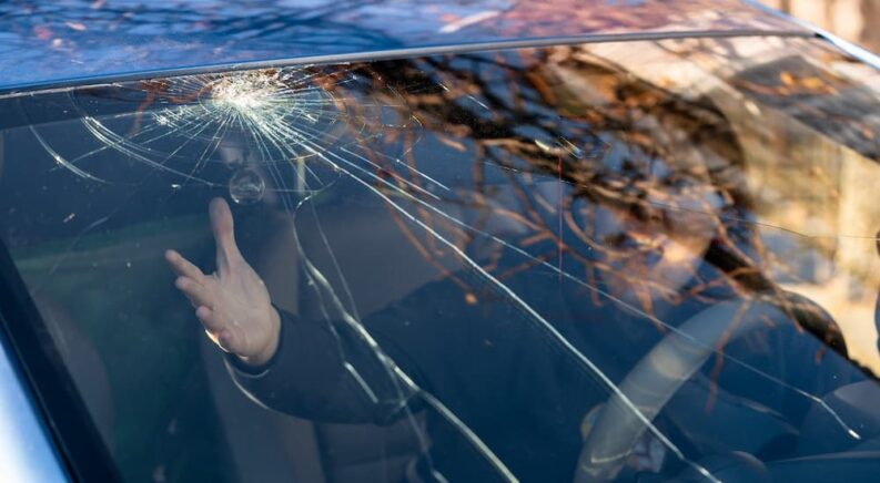 A windshield is shown cracked.