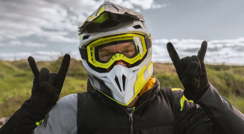 A biker is shown wearing a helmet.