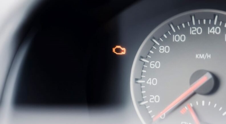 A check engine light in a car is shown.