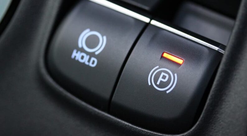 An emergency brake button is shown.