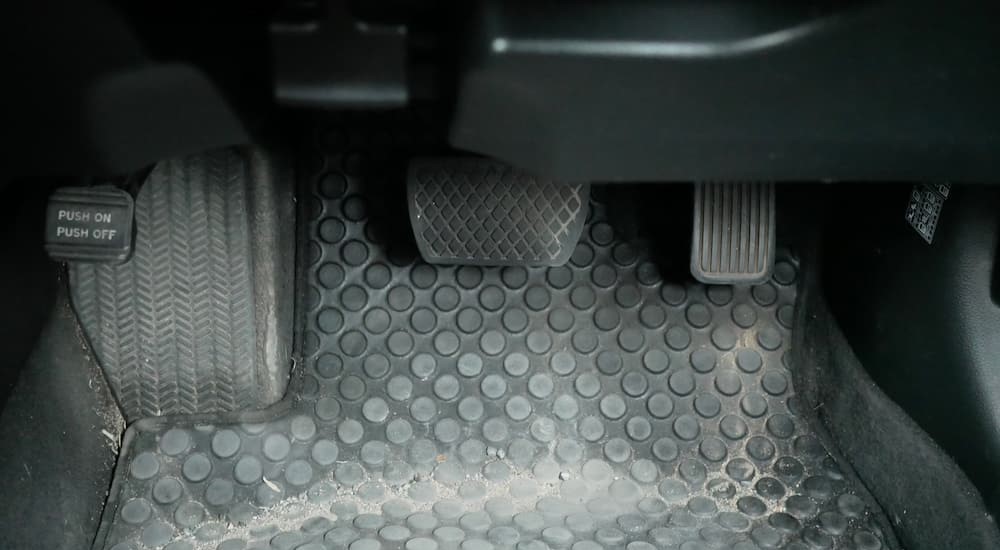 The emergency brake pedal is shown on the far left.