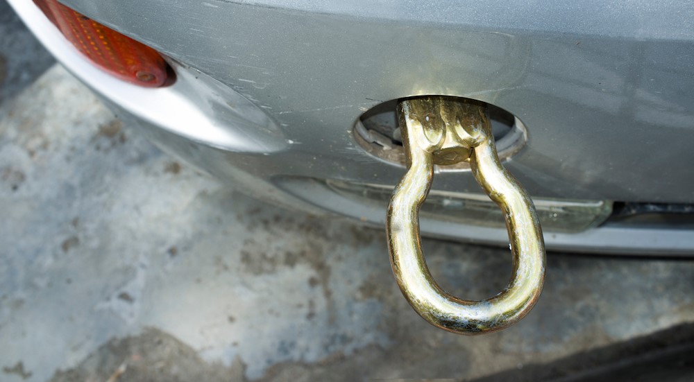 A tow hook recovery point on a vehicle is shown.