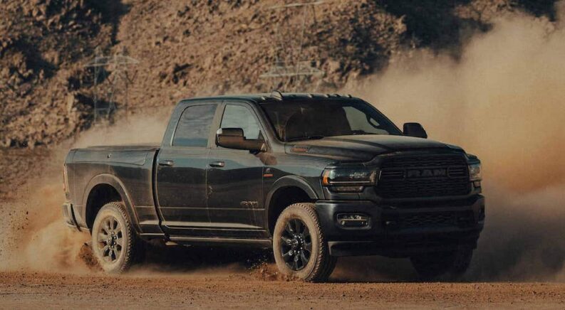 A black 2022 Ram 2500 Cummins is shown from the front at an angle.