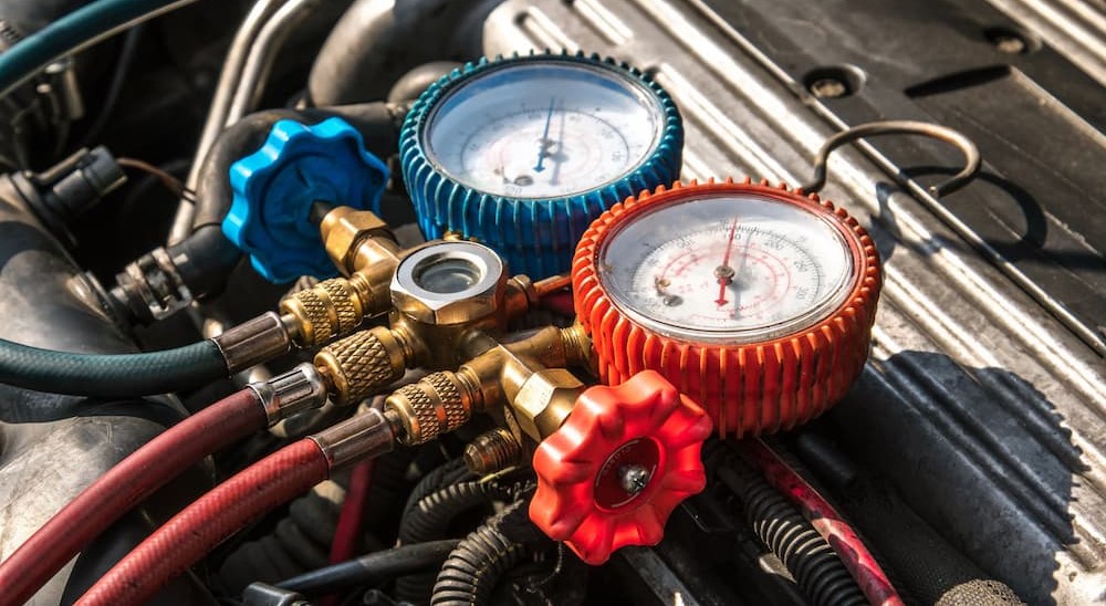 Ac manifold gauges on an engine.