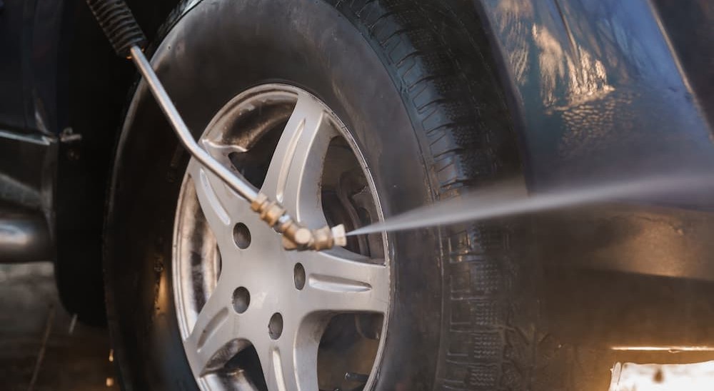 Tire being power-washed.