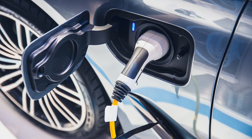 An EV charger plugged into a vehicle