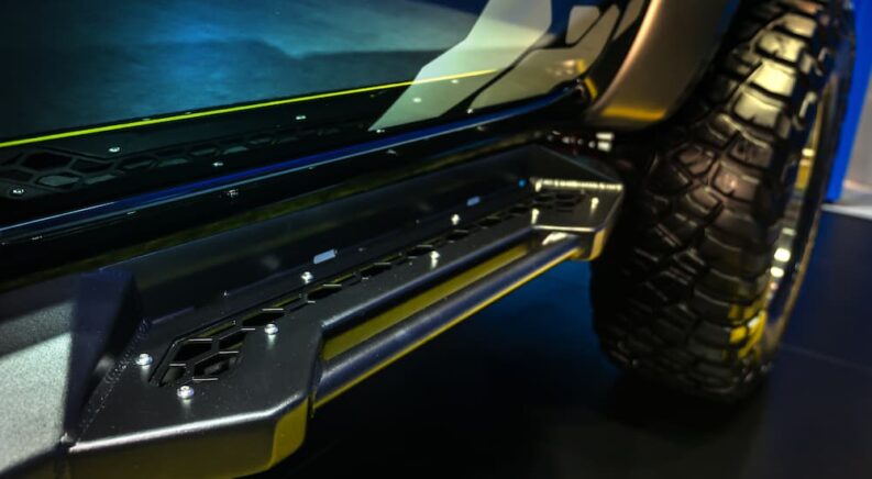 Truck steps on a lifted black truck