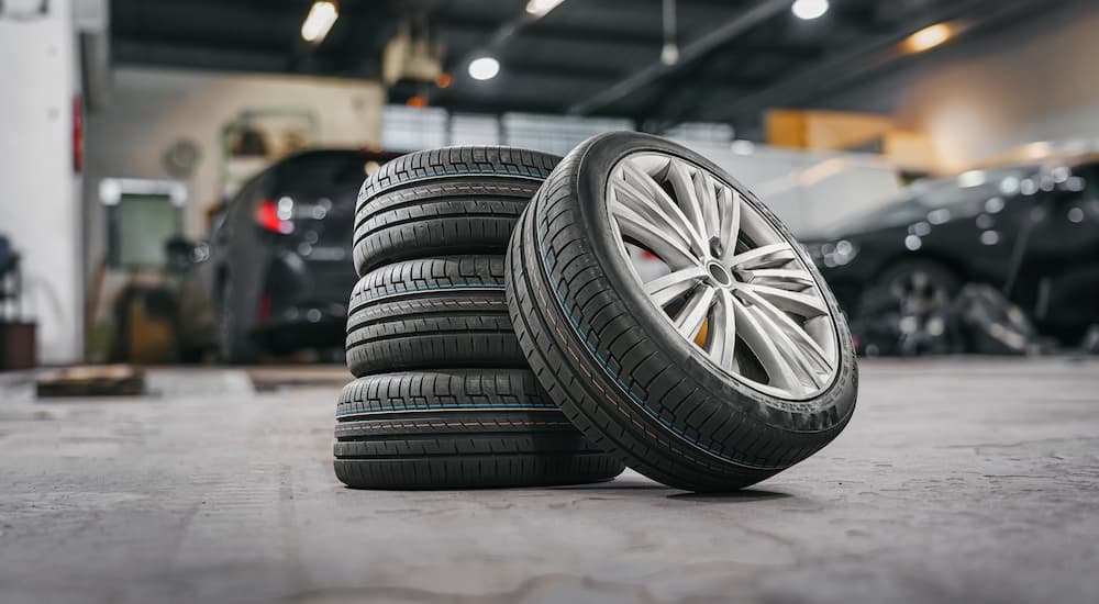 A stack of tires inside a tire shop.