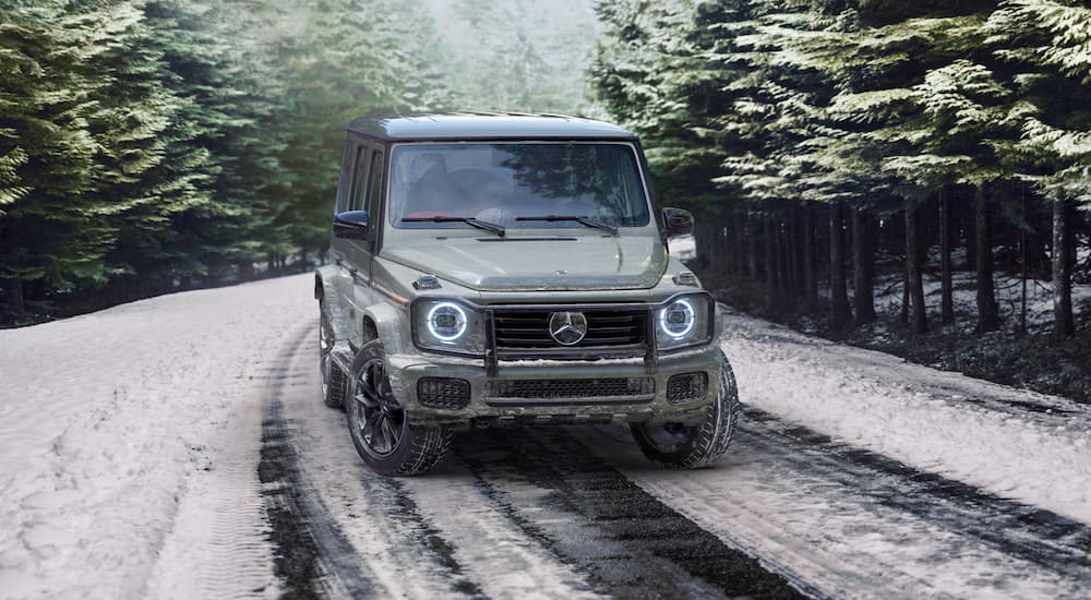 A gray 2026 Mercedes-Benz G-Class parked on a snowy road