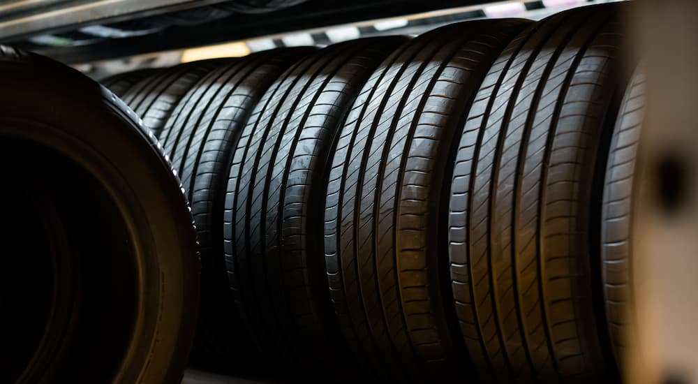 Multiple tires in a rack at a tire store