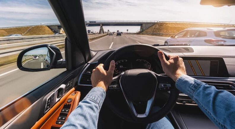 A person driving in a vehicle.