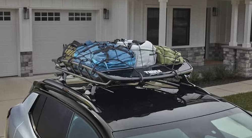 A roof basket on a silver SUV.